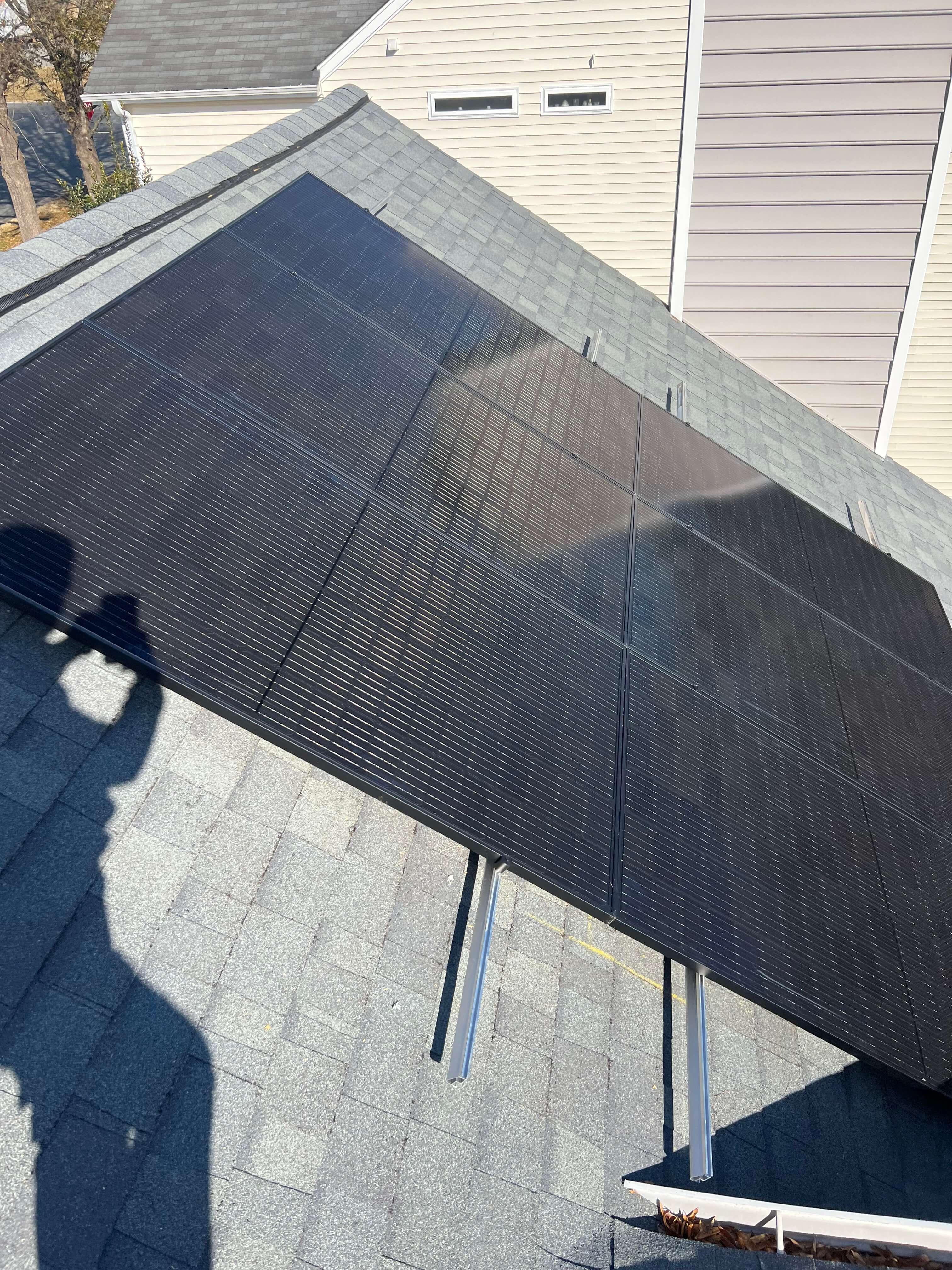 Top down view of solar panels on a roof on an overcast day